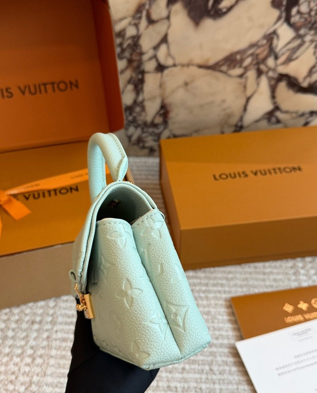 Louis Vuitton Nano Madeleine Monogram Empreinte Top-Handle Bag — side