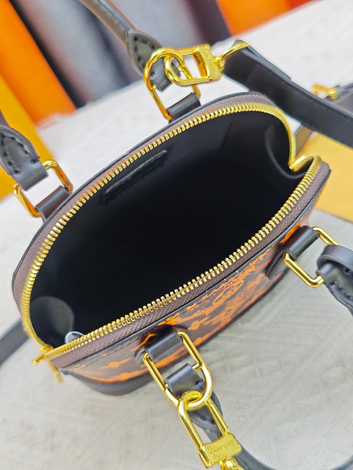 Louis Vuitton Alma BB Domed Top-Handle Bag — detail