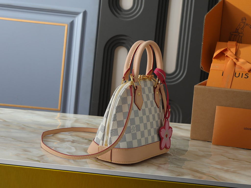 Louis Vuitton Alma Structured Top-Handle Bag — side