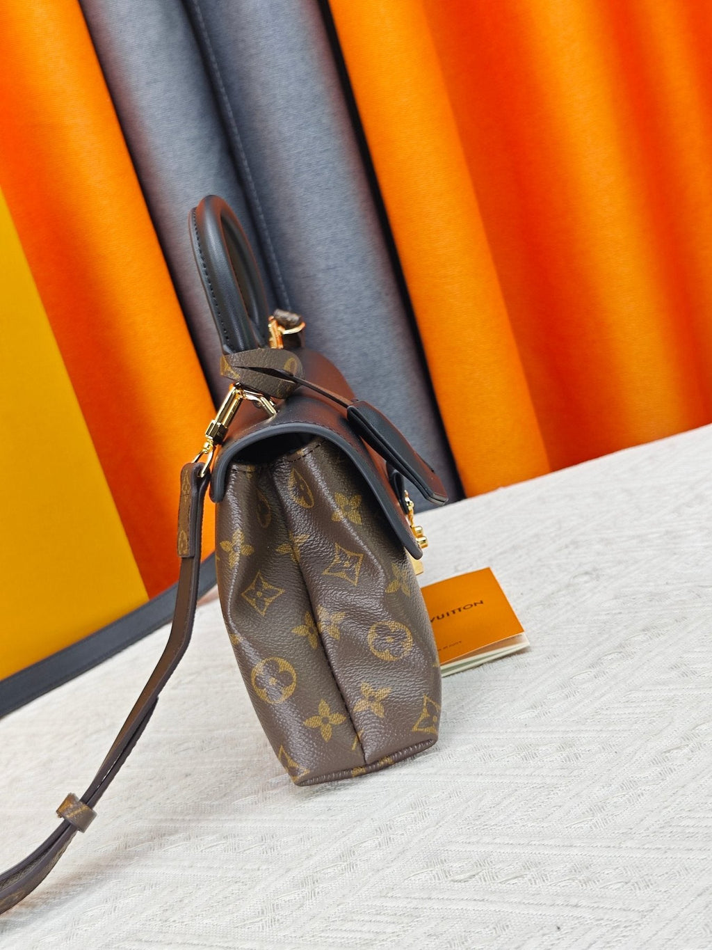 Louis Vuitton Madeleine BB Monogram Top-Handle Bag — side