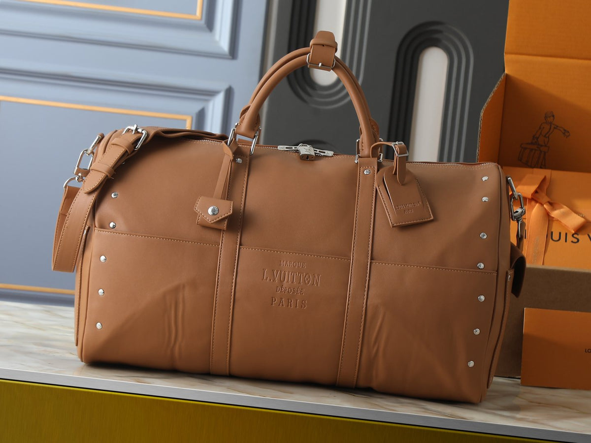 Louis Vuitton Keepall Studded Tan Duffel Bag — hero