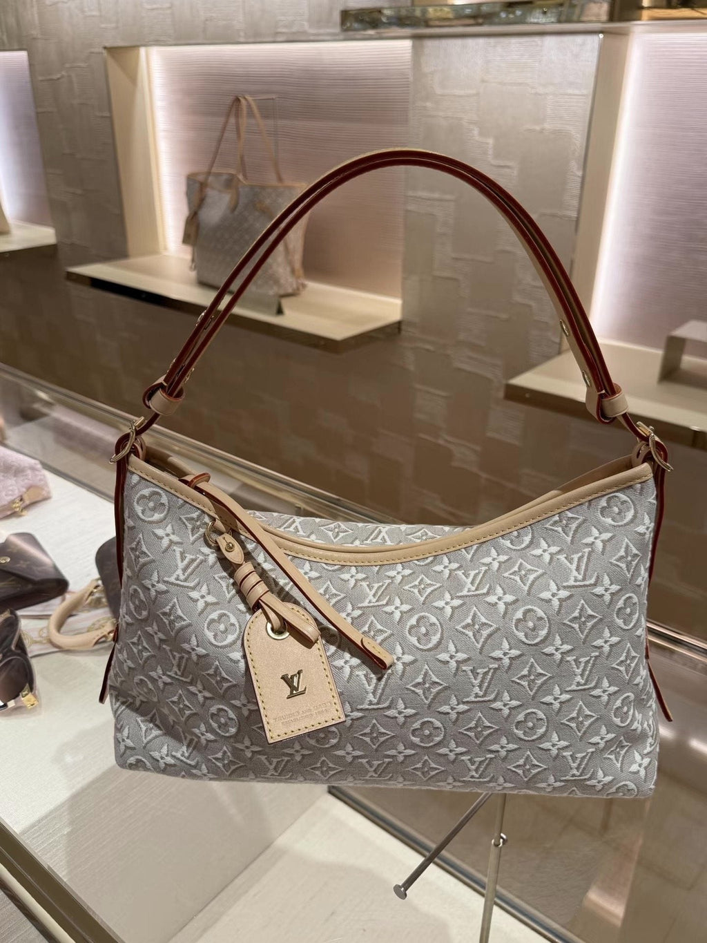 Louis Vuitton Carryall East West Raised Monogram Shoulder Bag — hero