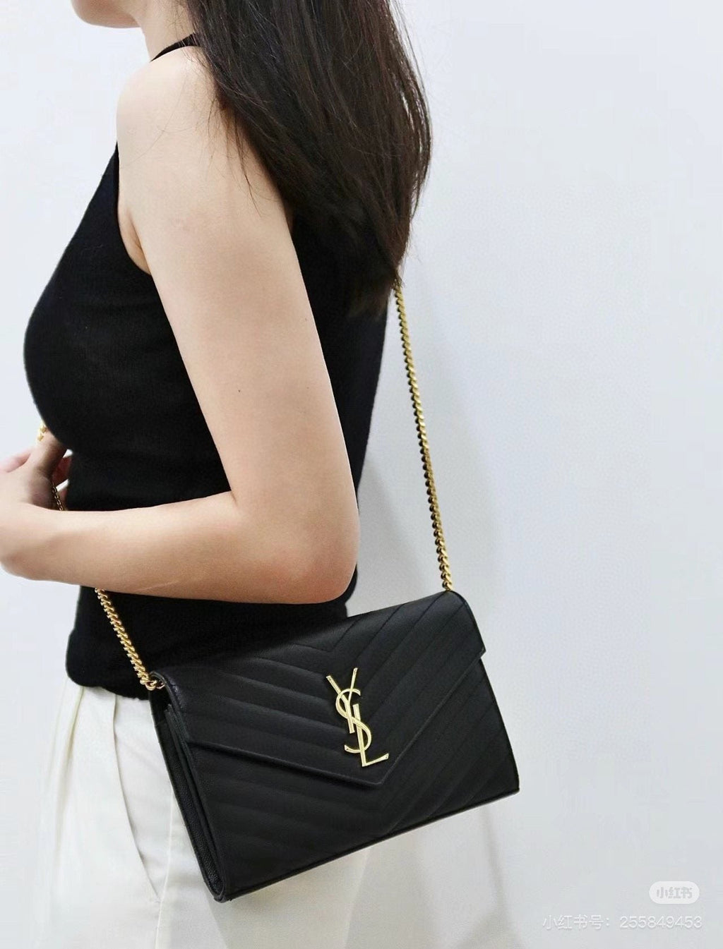 Saint Laurent Chevron-Quilted Envelope Wallet on Chain — model