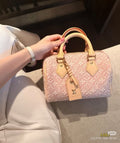 Louis Vuitton Speedy Monogram Barrel Handbag — hero