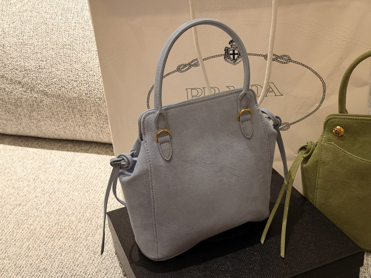 Prada Curved-Pocket Top-Handle Bag — comparison