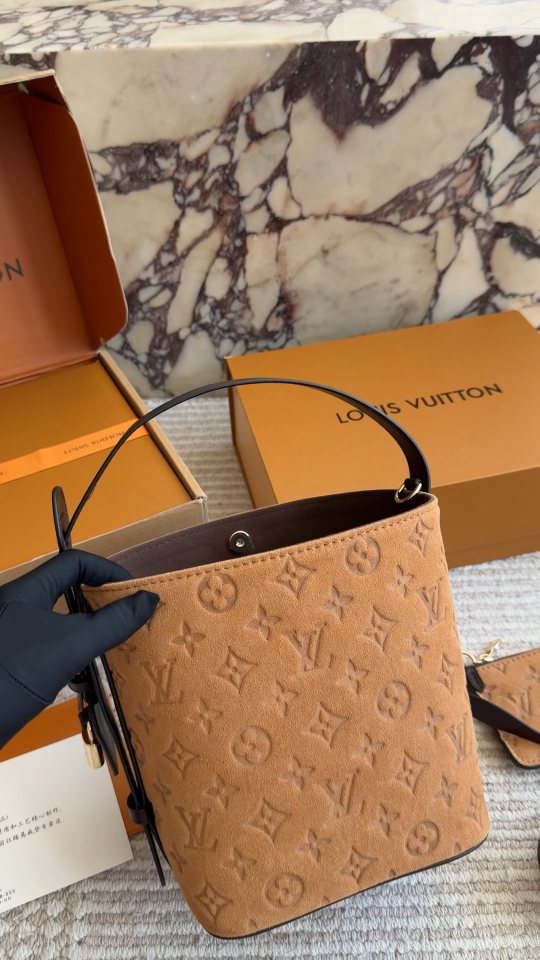 Louis Vuitton Tan Embossed Monogram Bucket Bag — hero