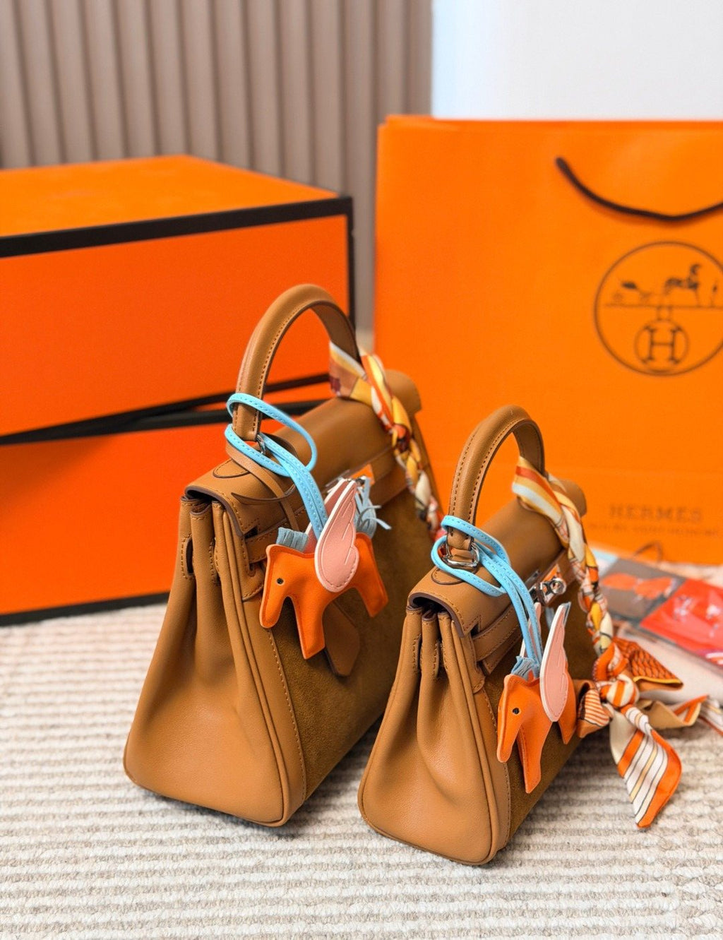 Hermès Kelly Top-Handle Bag with Silver-Tone Hardware — comparison