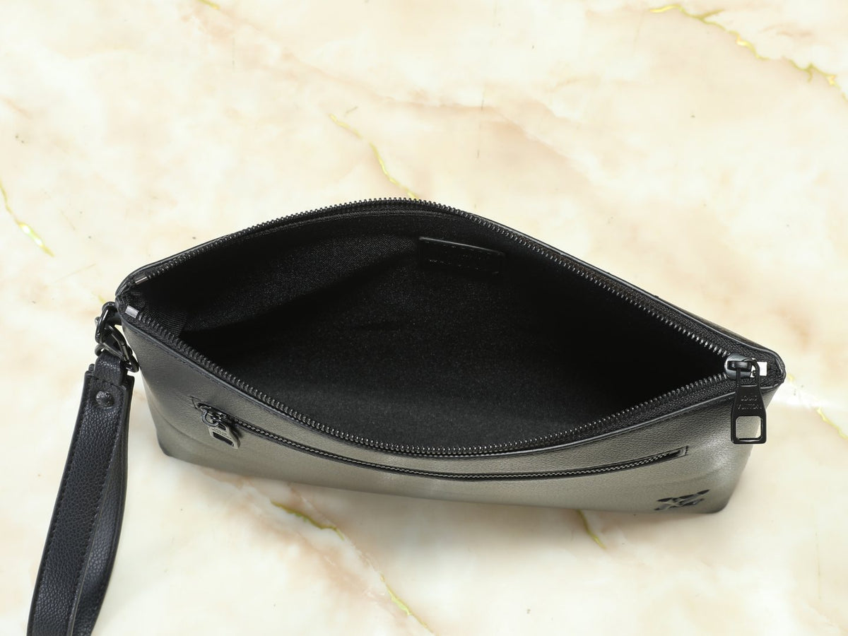 Louis Vuitton Takeoff Leather Wristlet Clutch — detail
