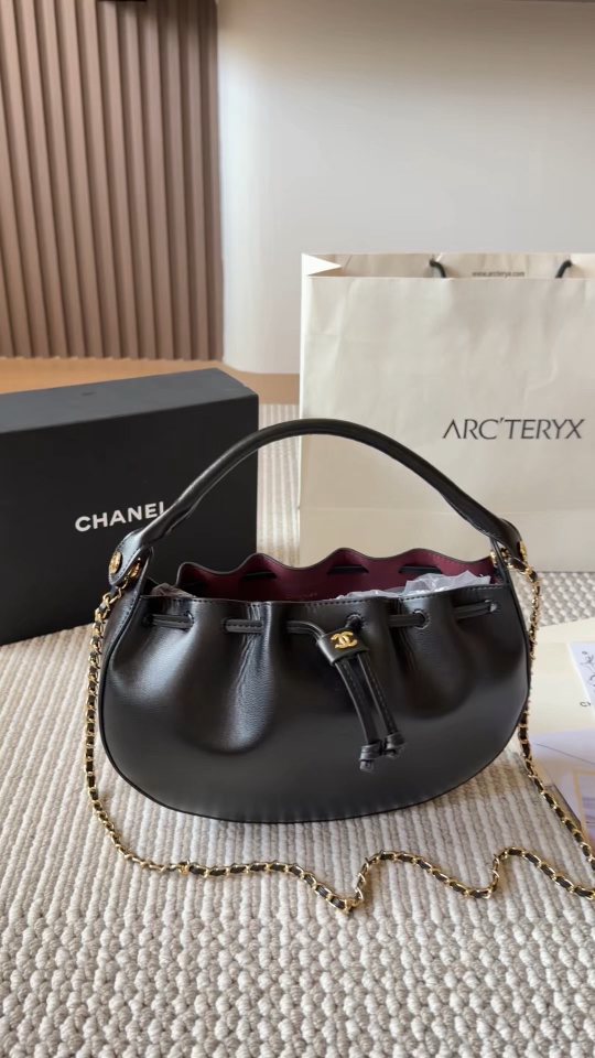 Chanel Black Rounded Drawstring Top-Handle Bag — hero